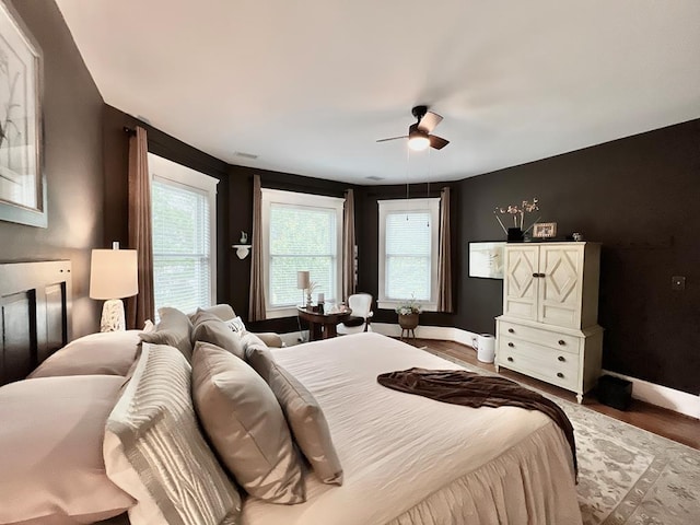 2453 Sand Hill Dr, Cape Charles, VA 23310 - bedroom with baseboards, a ceiling fan, and wood finished floors