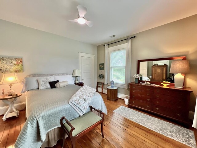 2453 Sand Hill Dr, Cape Charles, VA 23310 - bedroom featuring wood-type flooring, baseboards, and a ceiling fan
