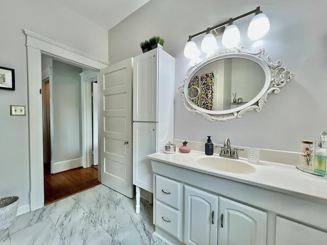 2453 Sand Hill Dr, Cape Charles, VA 23310 - bathroom featuring marble finish floors, vanity, and baseboards