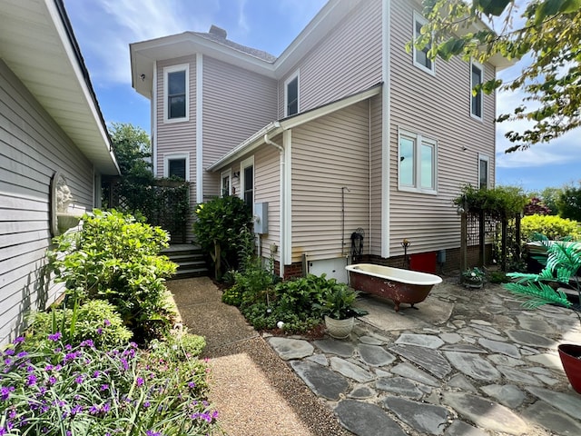 2453 Sand Hill Dr, Cape Charles, VA 23310 - view of side of home with a patio and crawl space