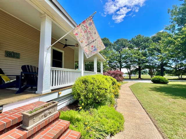 2453 Sand Hill Dr, Cape Charles, VA 23310 - view of green lawn with a porch and ceiling fan