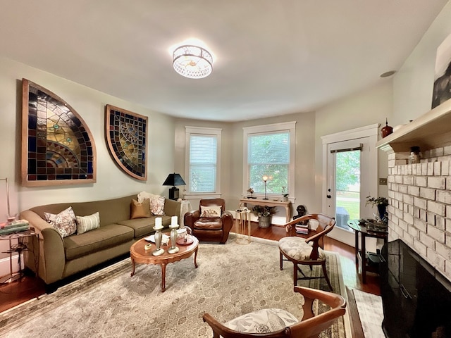2453 Sand Hill Dr, Cape Charles, VA 23310 - living room with wood finished floors and a brick fireplace