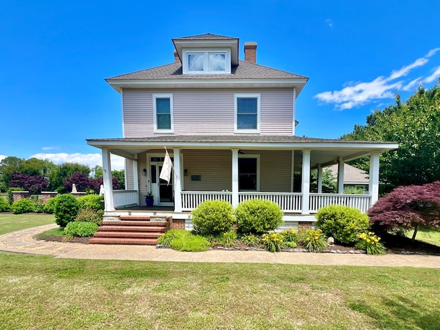 2453 Sand Hill Dr, Cape Charles, VA 23310 - view of front facade featuring a front lawn, covered porch, and a chimney