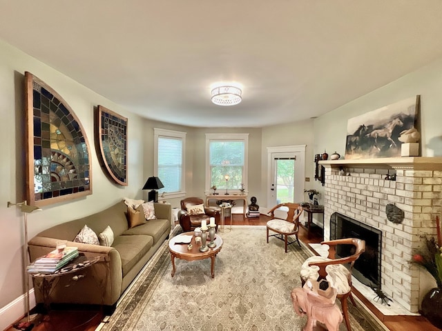 2453 Sand Hill Dr, Cape Charles, VA 23310 - living room with wood finished floors, a fireplace, and baseboards