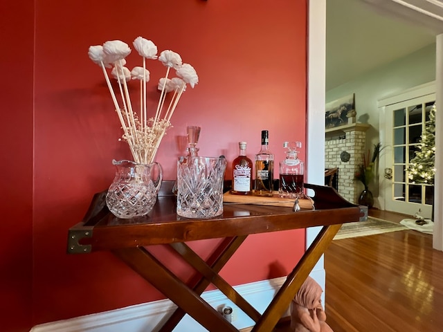 2453 Sand Hill Dr, Cape Charles, VA 23310 - detailed view of wood finished floors, a fireplace, and a chandelier
