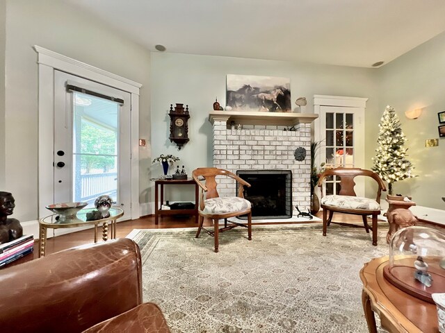 2453 Sand Hill Dr, Cape Charles, VA 23310 - living area featuring a fireplace and wood finished floors