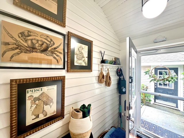 2453 Sand Hill Dr, Cape Charles, VA 23310 - doorway featuring vaulted ceiling and wood walls