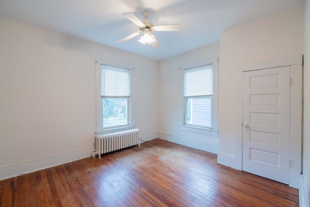 205 Monroe Ave, Cape Charles, VA 23310 - spare room featuring radiator heating unit, wood finished floors, baseboards, and ceiling fan