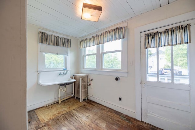 205 Monroe Ave, Cape Charles, VA 23310 - bathroom featuring radiator heating unit, wood finished floors, baseboards, and wooden ceiling