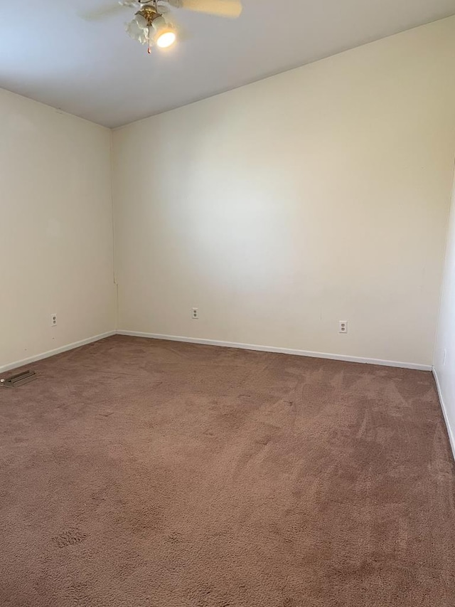 unfurnished room featuring carpet and ceiling fan