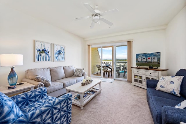 carpeted living room featuring ceiling fan