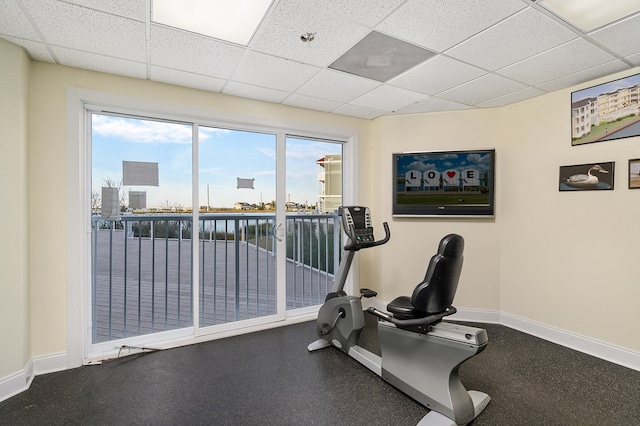 exercise room featuring a paneled ceiling