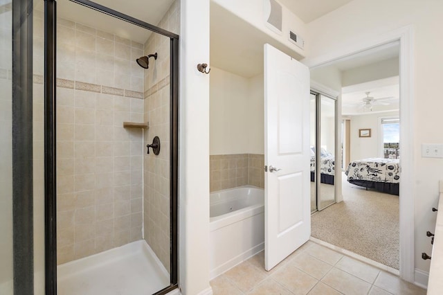 bathroom featuring tile patterned floors, ceiling fan, and shower with separate bathtub