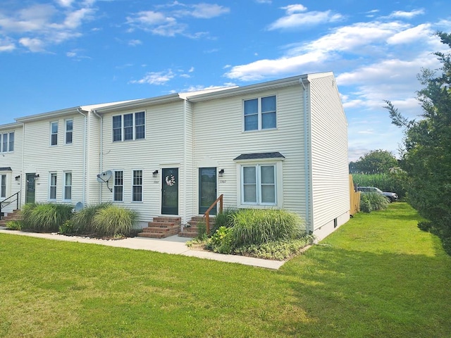 7207 Bunting Rd, Chincoteague, VA 23336 - view of front facade with entry steps and a front lawn