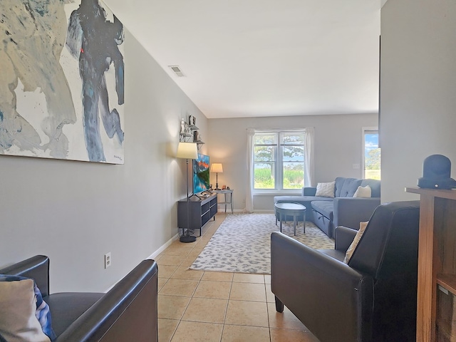 7207 Bunting Rd, Chincoteague, VA 23336 - living room with light tile patterned floors and baseboards