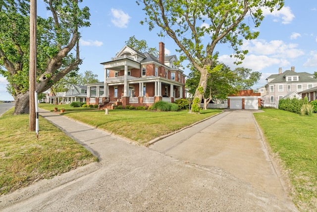 306 Bay Ave, Cape Charles, VA 23310 - neoclassical / greek revival house featuring a front yard, brick siding, a porch, and a detached garage