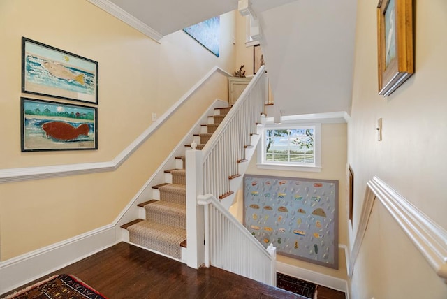306 Bay Ave, Cape Charles, VA 23310 - stairway featuring a high ceiling, wood finished floors, baseboards, and crown molding