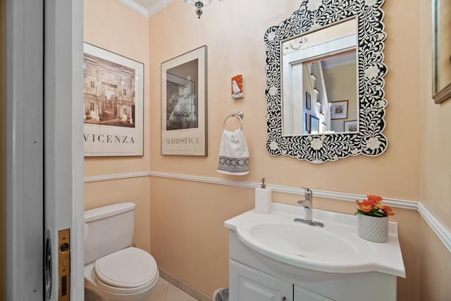 306 Bay Ave, Cape Charles, VA 23310 - bathroom with toilet, vanity, crown molding, and tile patterned floors