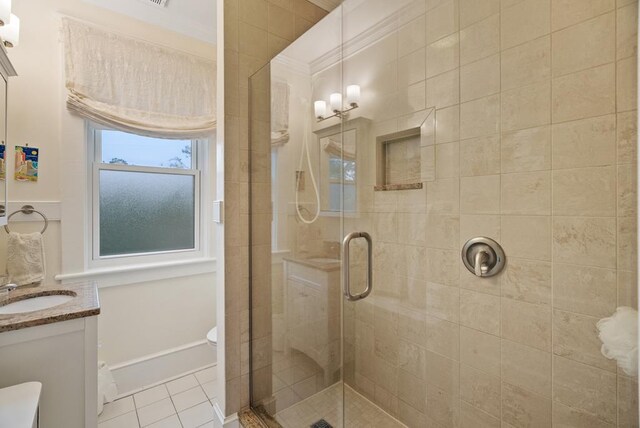 306 Bay Ave, Cape Charles, VA 23310 - bathroom with toilet, a stall shower, vanity, tile patterned floors, and crown molding
