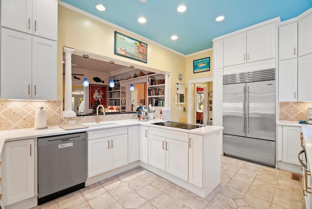 306 Bay Ave, Cape Charles, VA 23310 - kitchen featuring appliances with stainless steel finishes, a sink, crown molding, recessed lighting, and white cabinetry
