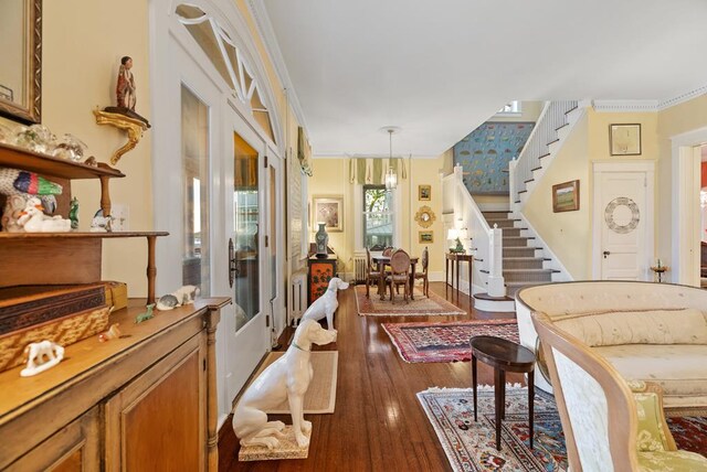 306 Bay Ave, Cape Charles, VA 23310 - sitting room featuring stairs, hardwood / wood-style floors, and crown molding