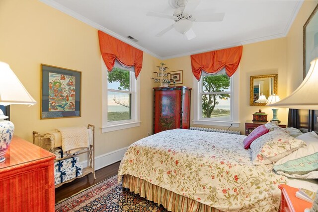 306 Bay Ave, Cape Charles, VA 23310 - bedroom with wood finished floors, crown molding, baseboards, and a ceiling fan