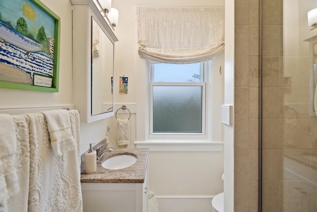 306 Bay Ave, Cape Charles, VA 23310 - bathroom featuring vanity, a tile shower, and toilet