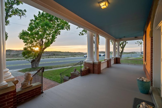 306 Bay Ave, Cape Charles, VA 23310 - patio terrace at dusk with covered porch and a water view