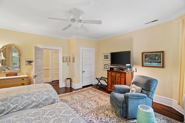 306 Bay Ave, Cape Charles, VA 23310 - bedroom with crown molding, dark wood-style floors, baseboards, and ceiling fan
