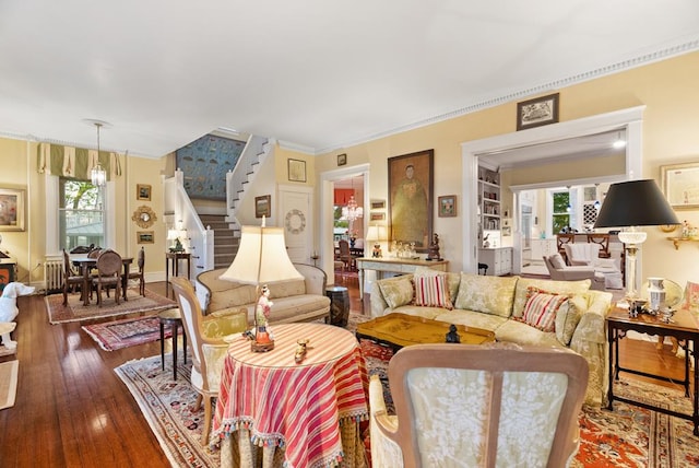 306 Bay Ave, Cape Charles, VA 23310 - living room featuring stairs, ornamental molding, and wood-type flooring