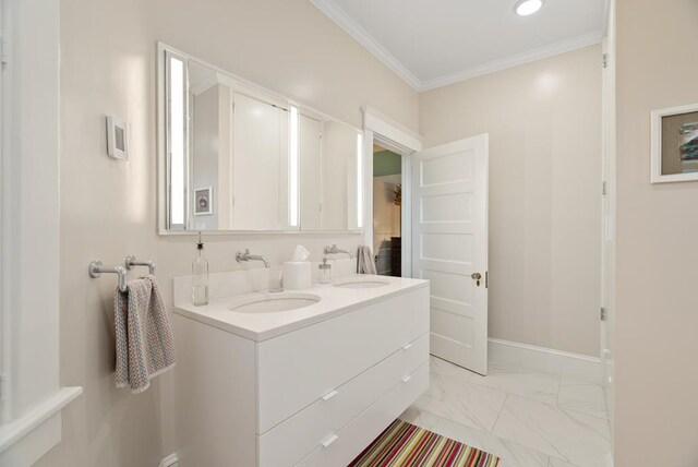 306 Bay Ave, Cape Charles, VA 23310 - bathroom with double vanity, marble look tile flooring, ornamental molding, and baseboards