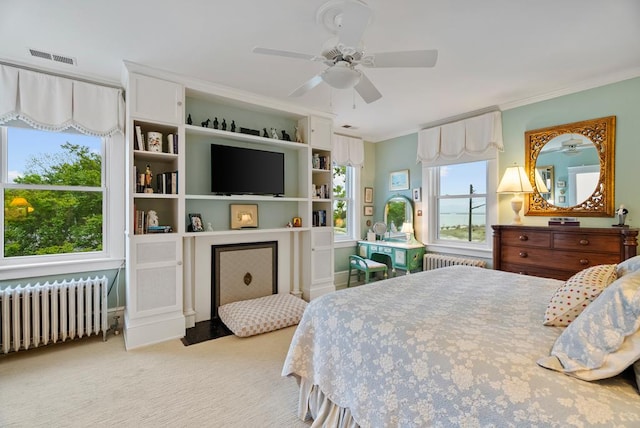 306 Bay Ave, Cape Charles, VA 23310 - bedroom featuring radiator, crown molding, light colored carpet, and a ceiling fan