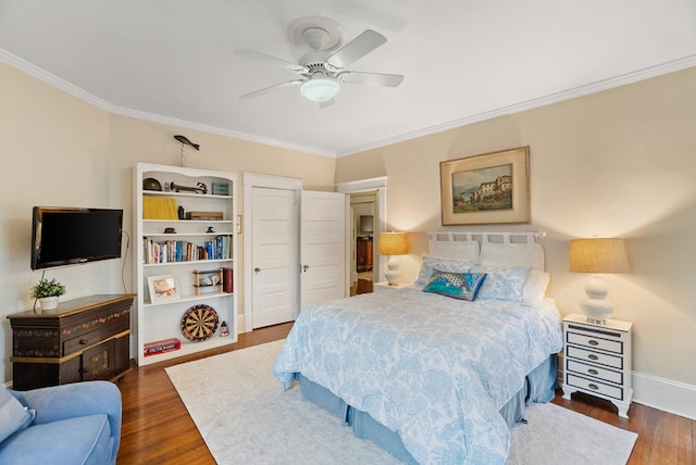 306 Bay Ave, Cape Charles, VA 23310 - bedroom with ornamental molding, wood finished floors, baseboards, and ceiling fan