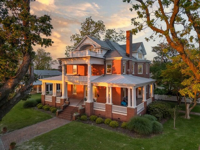 306 Bay Ave, Cape Charles, VA 23310 - back of house with a balcony, a porch, brick siding, a chimney, and crawl space