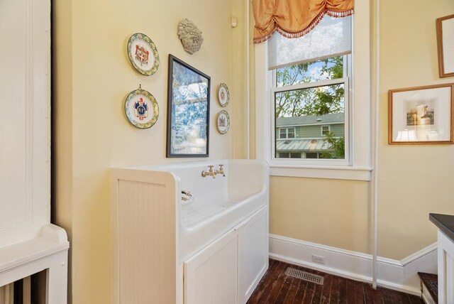 306 Bay Ave, Cape Charles, VA 23310 - bathroom featuring wood finished floors and baseboards
