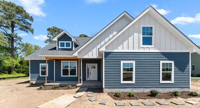 3245 Yarmouth Dr, Cape Charles, VA 23310 - view of front of home featuring board and batten siding, a porch, and a shingled roof