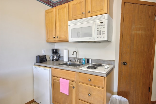 kitchen with white appliances and sink