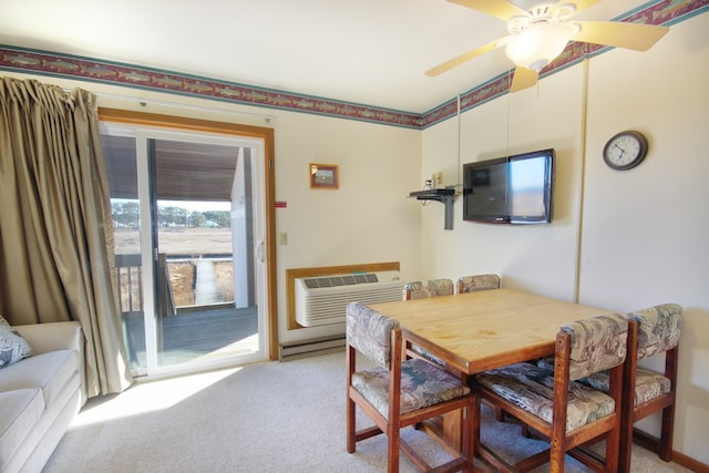 carpeted dining space featuring ceiling fan and a wall mounted AC