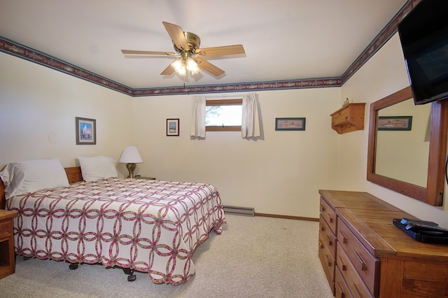 bedroom with ceiling fan, light carpet, and a baseboard heating unit