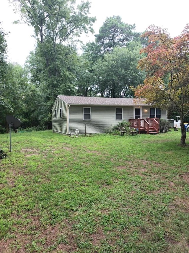 view of yard with a wooden deck