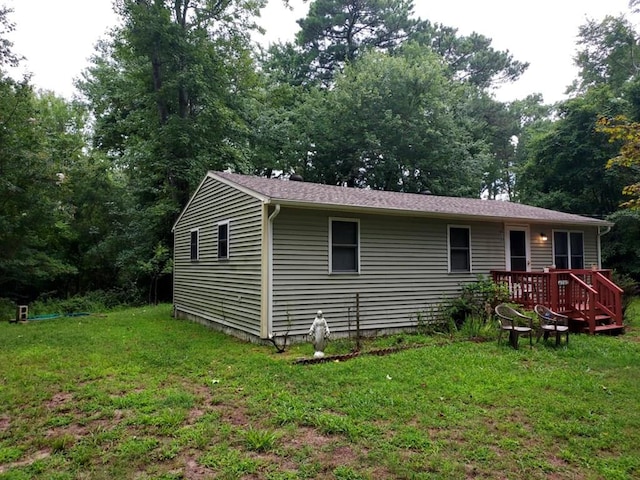 4202 Cherrix Ln, Chincoteague, VA 23336 - view of property exterior with a lawn