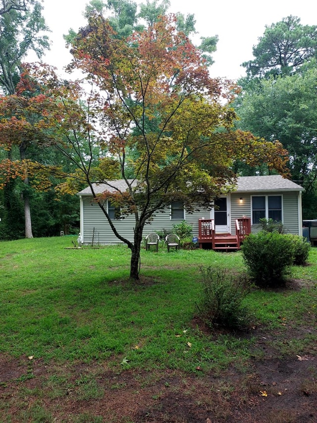 view of yard with a wooden deck