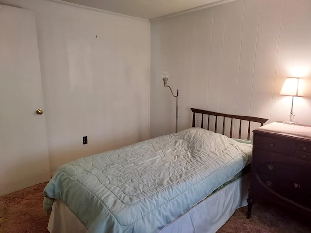 carpeted bedroom with crown molding