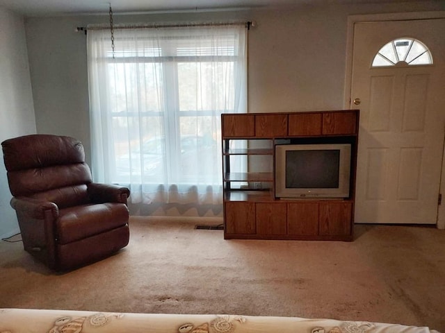 unfurnished living room featuring carpet flooring