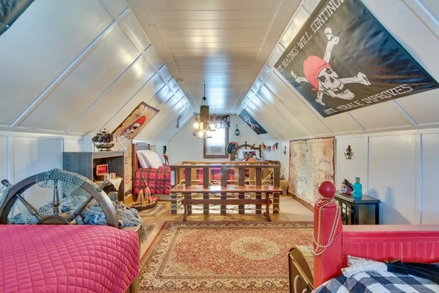 bedroom with lofted ceiling and hardwood / wood-style floors