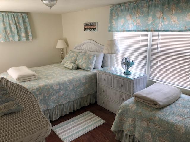 bedroom featuring dark wood-type flooring