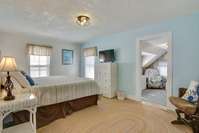 bedroom featuring light colored carpet