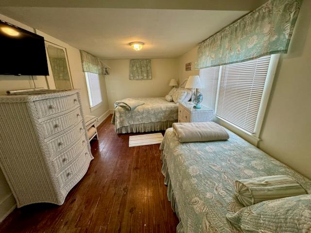 bedroom featuring dark wood-type flooring