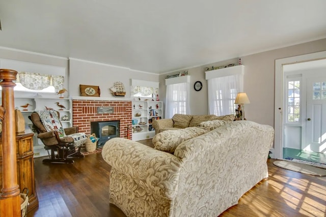 living room featuring a fireplace and dark hardwood / wood-style flooring