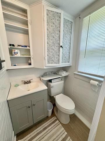 bathroom with vanity, hardwood / wood-style floors, and toilet